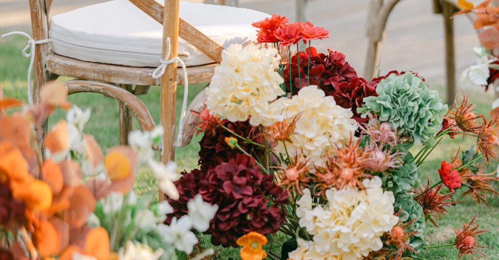 Charming outdoor wedding setup with rustic chairs and vibrant floral arrangements.
